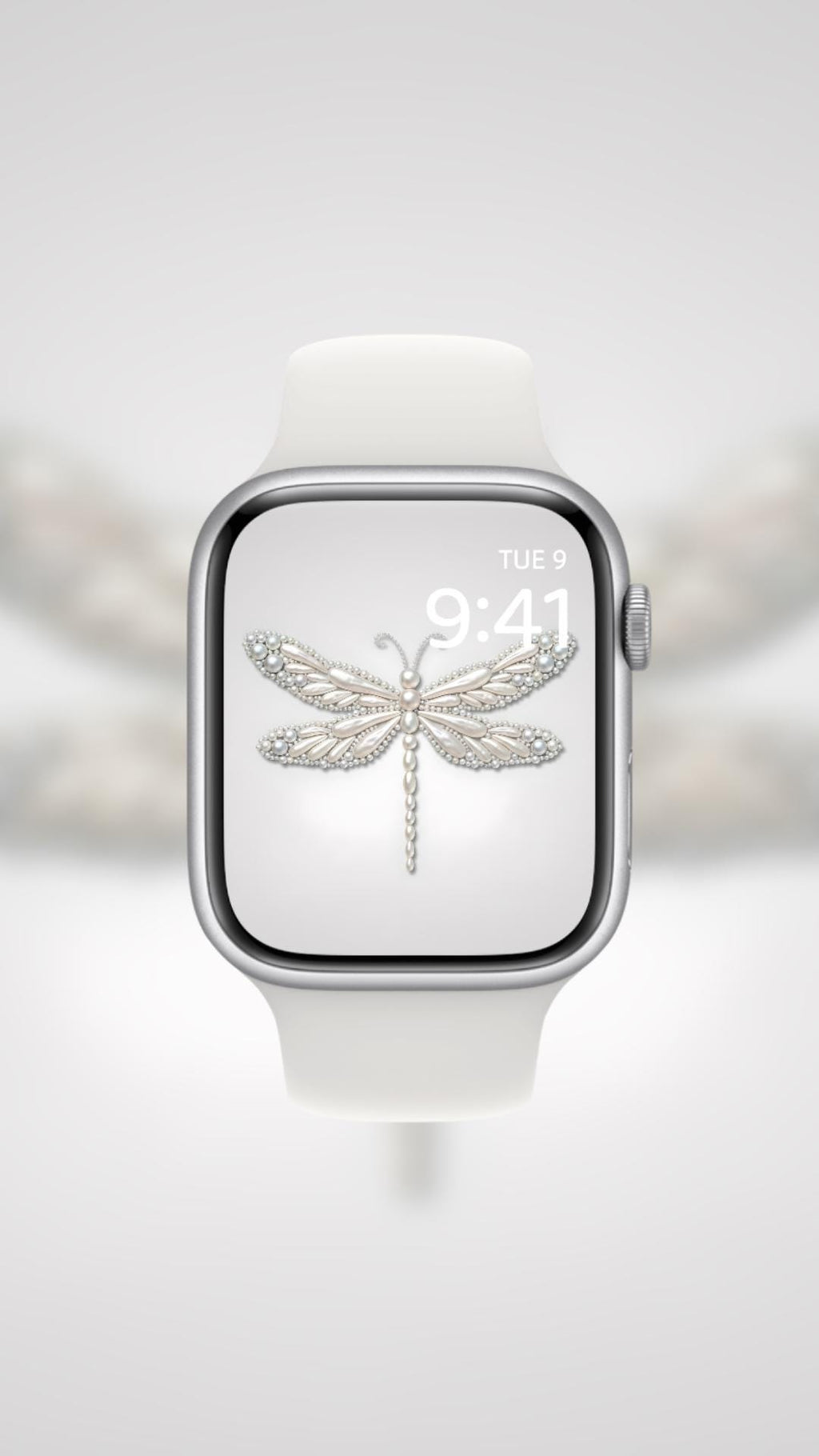 Smartwatch with a dragonfly icon on the screen against a blurred background