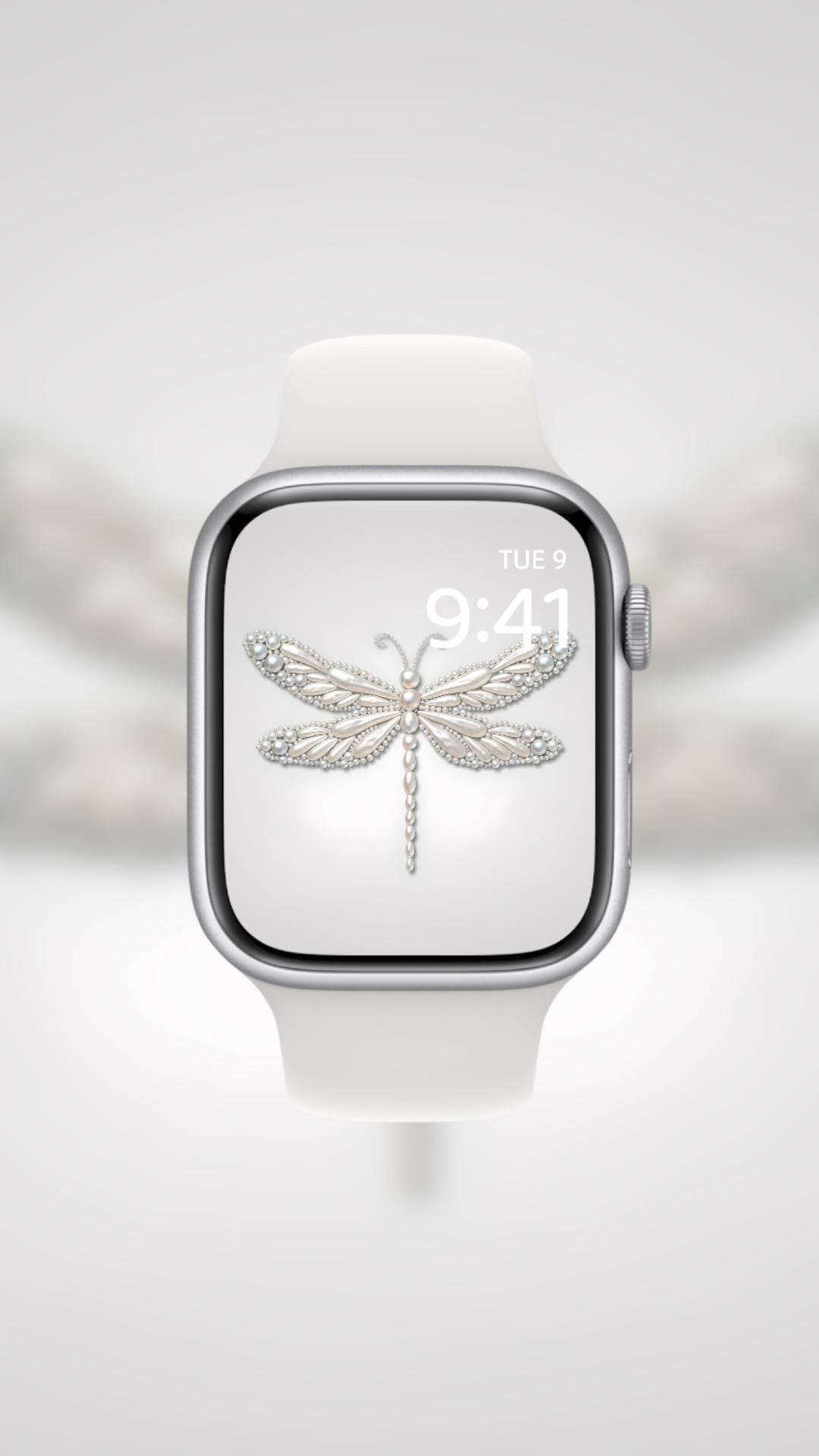 Smartwatch with a dragonfly icon on the screen against a blurred background